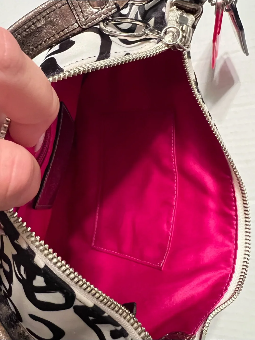 Coach Poppy small satin shoulder bag with pink accents and lining